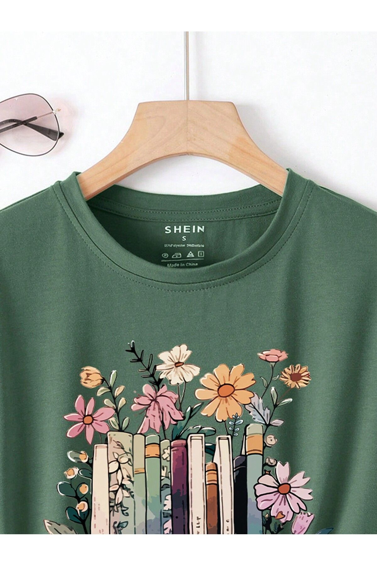 Green “Garden of Books” Floral Stack Graphic Tee – Book Lover’s T-Shirt